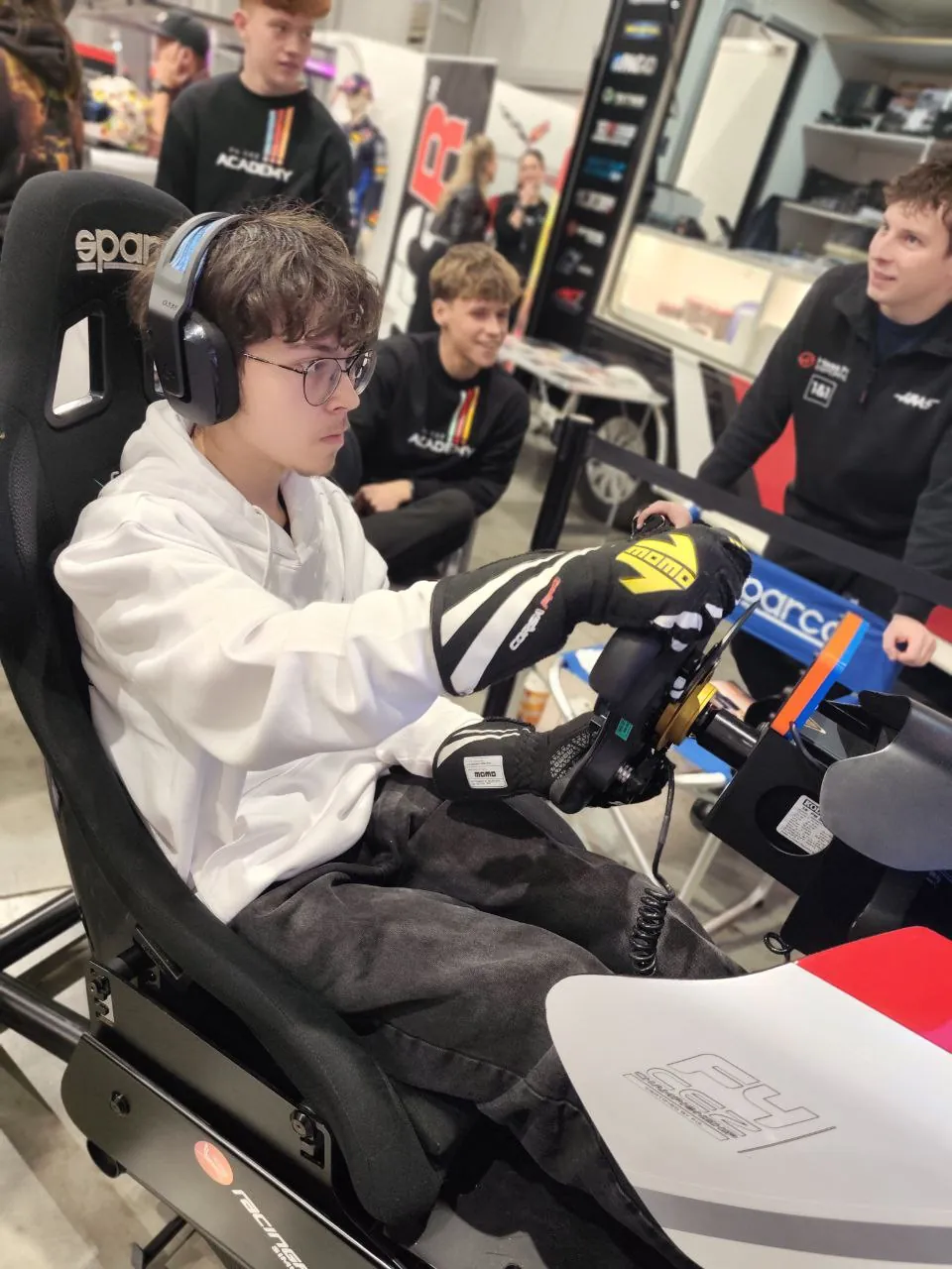 Oliver driving a sim racing rig