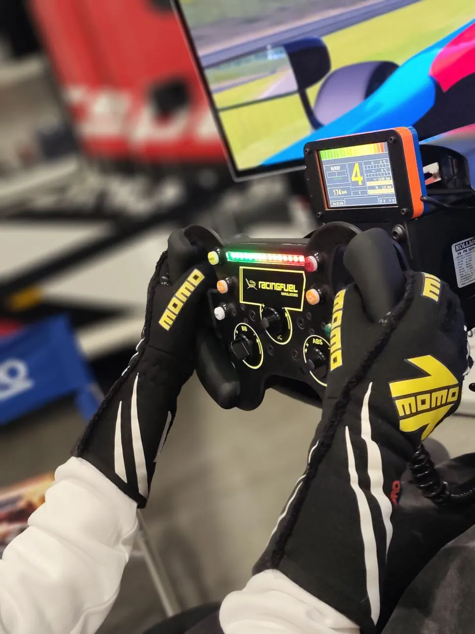 Oliver's hands on the sim racing wheel
